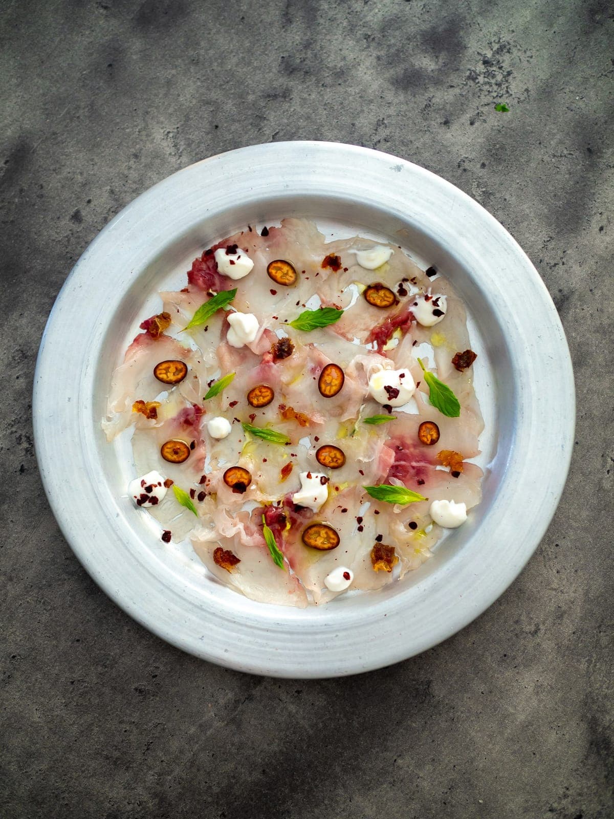 Carpaccio de dorade aux agrumes et à l'huile Lucques